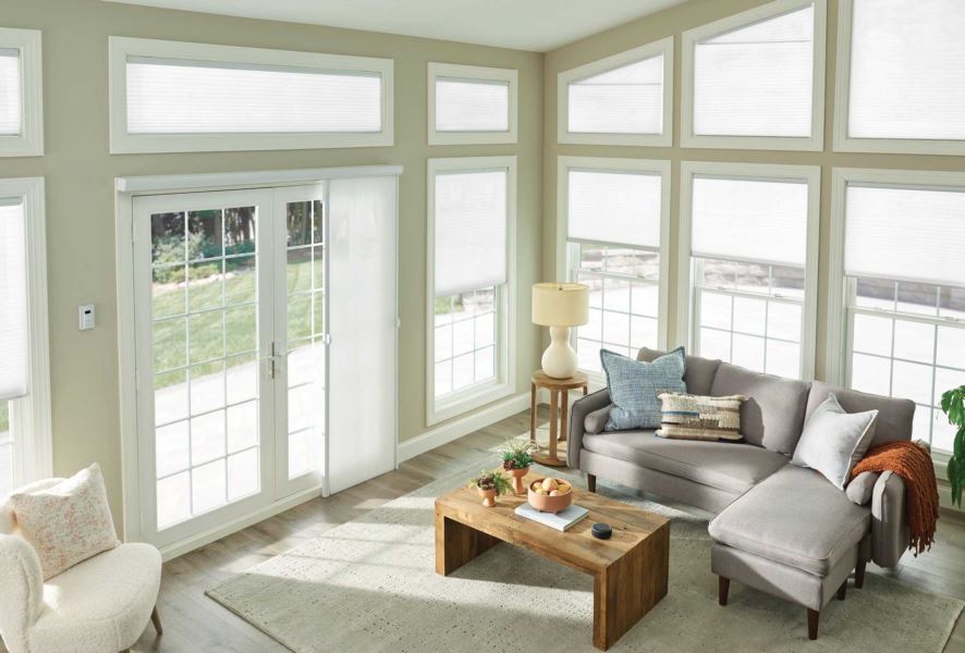 Use custom shades like top-down/bottom-up styles to give you more control over sunlight in your sunroom. cellular shades in a large sunroom